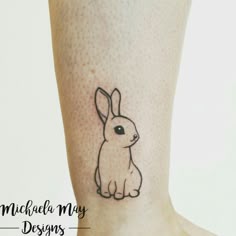 small bunny ankle tattoo — minimalist outline